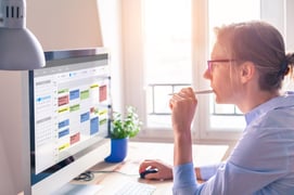 Woman color coding online calendar 